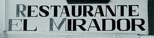Composite of Taxco commercial signs featuring inverted capital M letters.