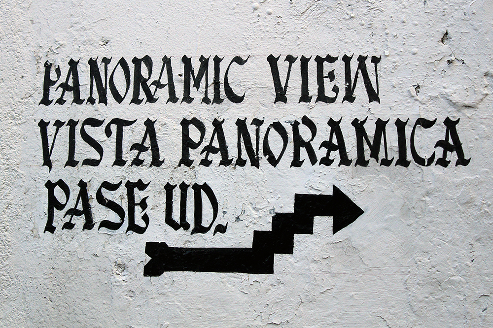 Hand-painted Taxco wall sign for panoramic view, photographed for the essay.