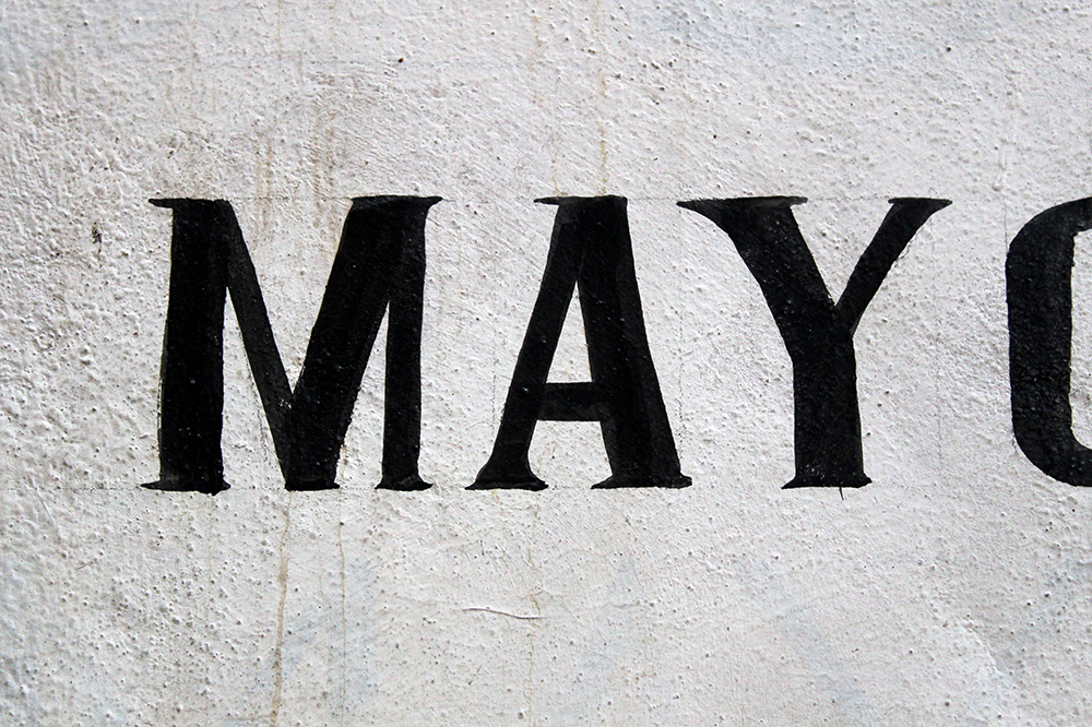 Handmade Taxco commercial sign with an inverted capital M.