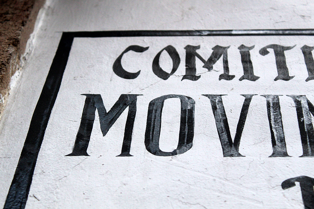 Handmade Taxco commercial sign with an inverted capital M.